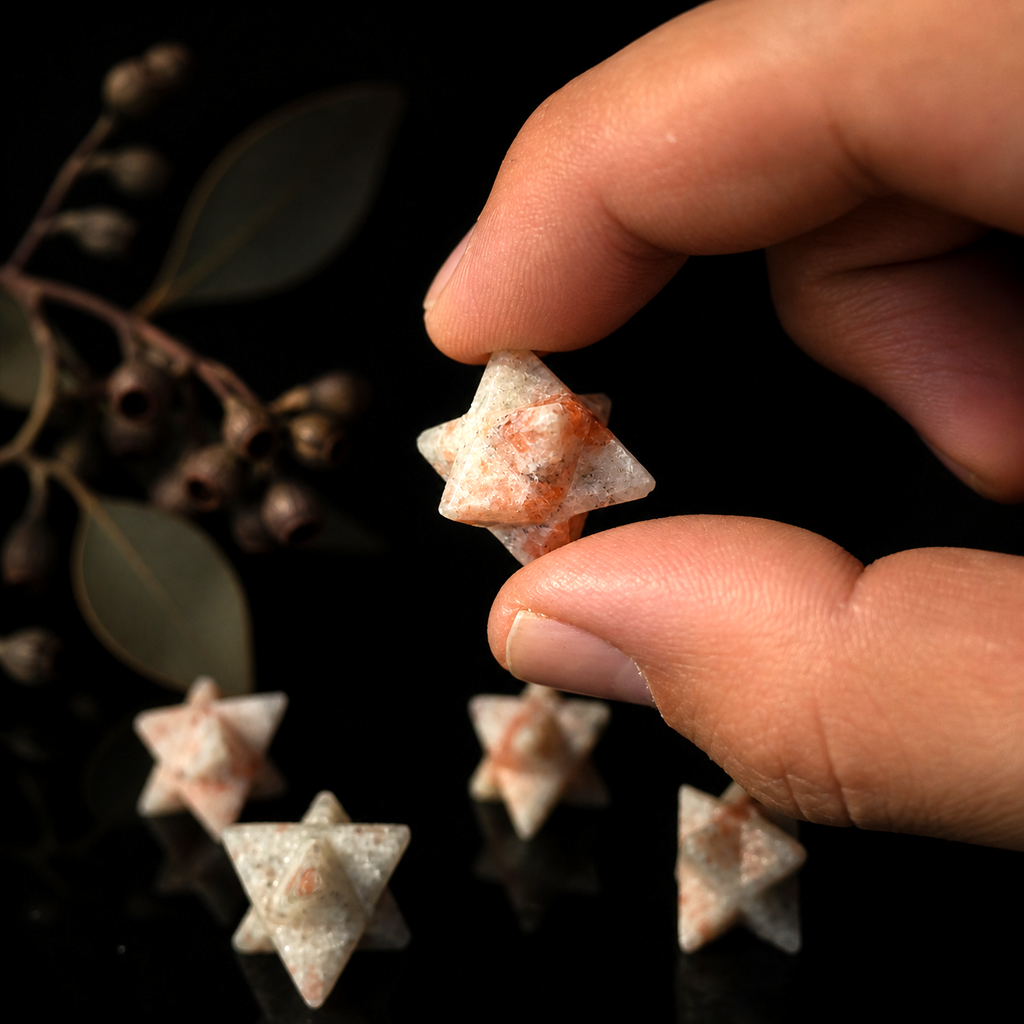 Polished Sunstone Merkaba crystal with warm shimmering orange and golden tones